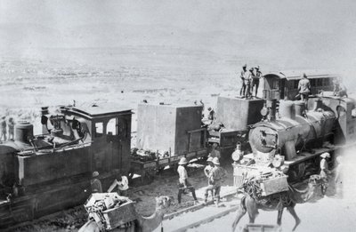Railway locomotives with supply camels in Mesopotamia during World War One, from an album compiled by Lt. Kindom by English Photographer